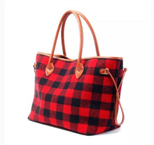 large black and red buffalo check plaid bag with brown straps. perfect for anytime of the year and super eye catching