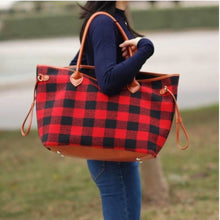 large black and red buffalo check plaid bag with brown straps. perfect for anytime of the year and super eye catching