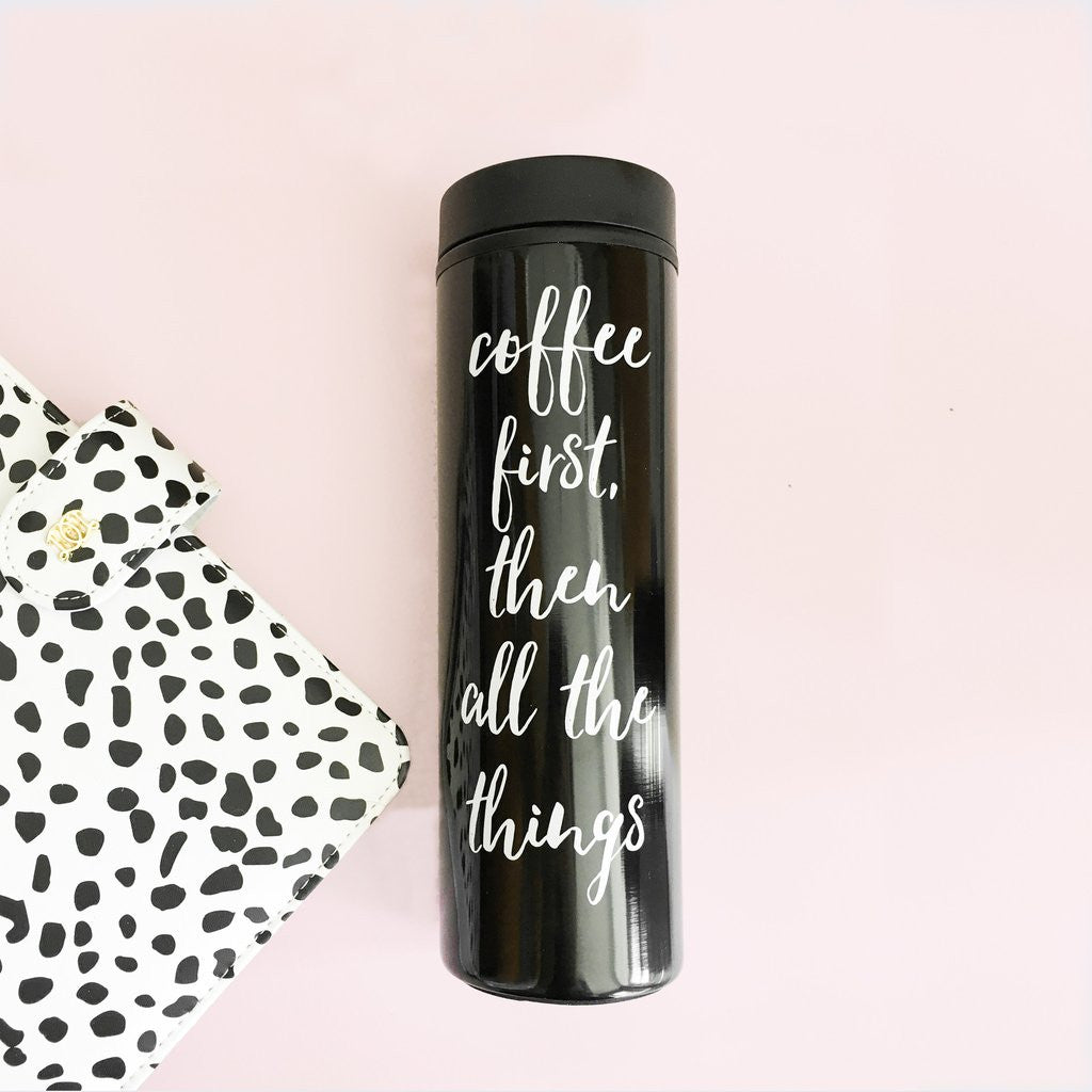 Black, double walled to go coffee travel mug with white Coffee first, then all the things