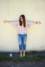 ivory and pink floral pattern 3/4 flyaway sleeves. light weight and flowy