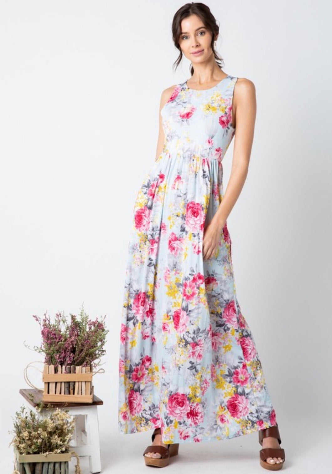 pale mint and floral print pattern long maxi dress with sleeveless top. cinched at small of wasit and has pockets
