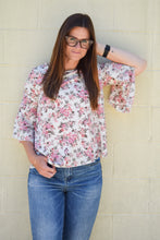 ivory and pink floral pattern 3/4 flyaway sleeves. light weight and flowy
