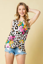 sleeveless floral and leopard mix print with a twist hem. perfect for summer and fall and cute with shorts or jeggings and sandals or booties.