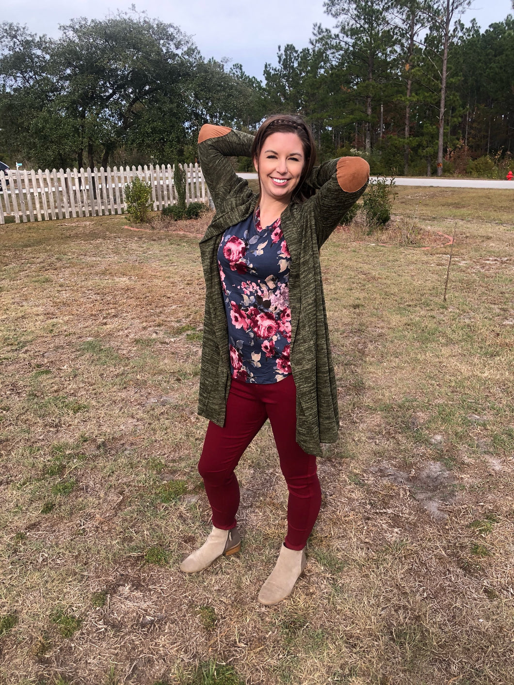 Long sleeve, past the knee in length, olive army green heathered look cardigan with faux brown suede elbow patches. Soft and cozy perfect for layering 