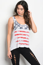 cream colored tank top with american flag distressed look and faded red, white, and blue design. racer back and flowing hem