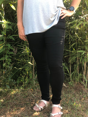 Black moto jeggings with real back pockets and an elastic waistband. can be worn everyday casual or with a dressy top and heels. S/M fit- 2-6. M/L fit- 8-10
