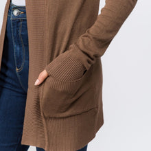 zoomed in picture of mocha brown colored soft and cozy cardigan with pockets. long sleeve and in between knee and butt length