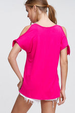 back view of hot pink cold shoulder shortsleeve top. shoulder ties at bottom 