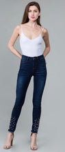dark wash skinny jeans with embellished pearls on shin down to frayed hem