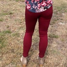 back of burgundy 5 pocket jeggings with an elastic waistband. super stretchy and super comfortable. perfect for a casual everyday look or with a dress shirt and heels. S/M fit- 2-6 M/L fit- 8-10