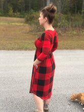 side view of 3/4 quarter sleeve past the knee midi black and red buffalo check plaid cinched and the small of your waist with pockets 