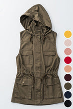 olive green sleeveless collared cargo vest with 4 front pockets, draw string at waist, and hood