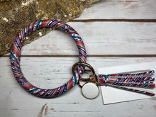 colorful aztec bangle ring keychair with tassle and monogram tag. large ring for any size wrist and easy clip for attaching keys. contains two 2 rings to attach keys to. colorful, cute, and fun.