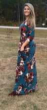 side view of Navy and floral print 3/4 long sleeve long maxi dress with stretchy, soft, and comfortable material with pockets. perfect for any occasion and so many seasons