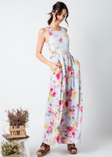 pale mint and floral print pattern long maxi dress with sleeveless top. cinched at small of wasit and has pockets