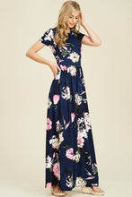 Navy and floral print short sleeve long maxi with soft and stretchy material, scoopneck, and pockets