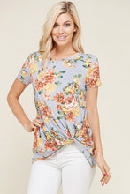 greyish lavender shortsleeve top with floral print and a twist hem at the bottom