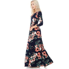side view of Navy and coral floral print 3/4 long sleeve long maxi dress with soft and stretchy material, scoopneck, and pockets