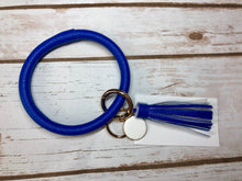 blue royal blue bangle ring keychair with tassle and monogram tag. large ring for any size wrist and easy clip for attaching keys. contains two 2 rings to attach keys to. monochromatic, cute, and fun.