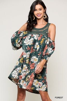 Forrest green floral with a crochet neckline. Cold shoulder with a 3/4 sleeve. Flowy and boho
