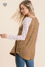 back view of long sleeve camel rust solid body with mauve and white striped long sleeves. round neck line and hem
