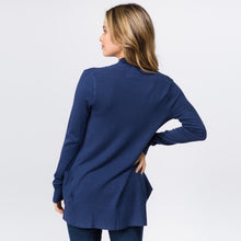 back view of Navy blue colored soft and cozy cardigan with pockets. long sleeve and in between knee and butt length