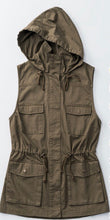 olive green sleeveless collared cargo vest with 4 front pockets, draw string at waist, and hood