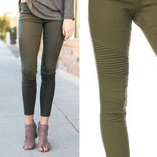 olive green moto jeggings with real back pockets and an elastic waistband. can be worn everyday casual or with a dressy top and heels. S/M fit- 2-6. M/L fit- 8-10