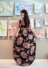 sleeveless black floral maxi with ivory waist and neck. light and flowy dress perfect for the summer
