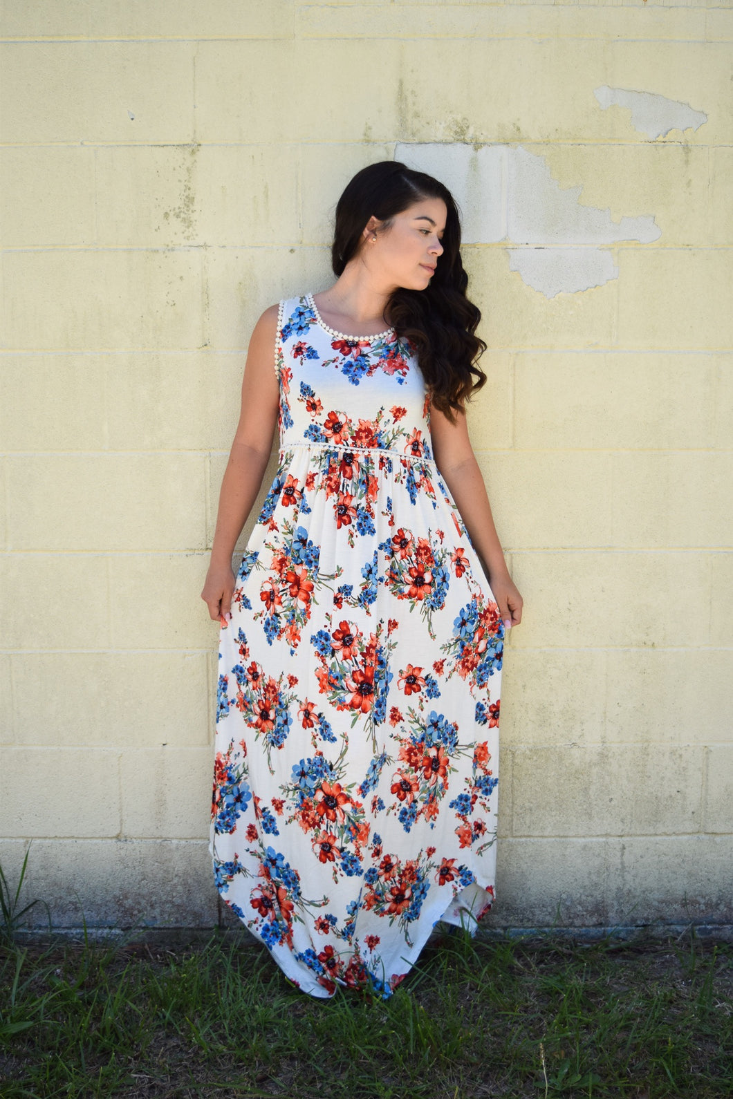 sleeveless ivory floral maxi with ivory waist and neck. light and flowy dress perfect for the summer. paired perfectly with your favorite wedges