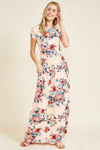 Short sleeve soft blush and floral print long maxi dress. Scoopneck and has pockets