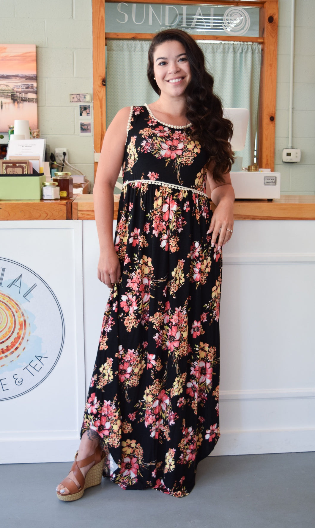 sleeveless black floral maxi with ivory waist and neck. light and flowy dress perfect for the summer. paired perfectly with your favorite wedges